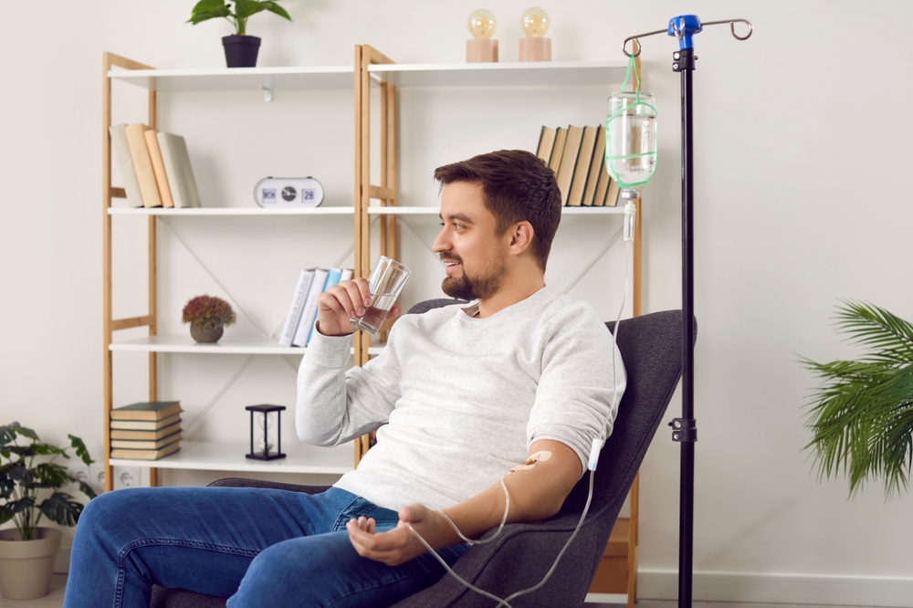 A man taking IV therapy for medical weight loss